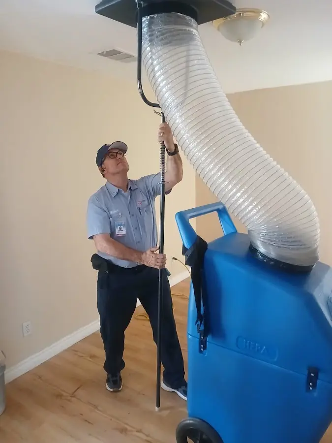 Furnace Tune-Up technician using HEPA equipment in Libertyville